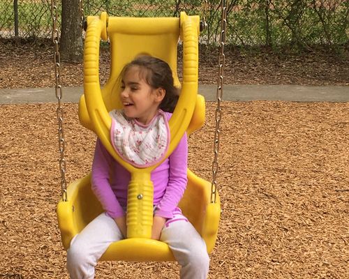 Child on adaptive swing — the joy we are building