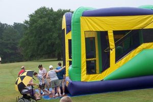Children with wheelchair at KidStuff bounce house